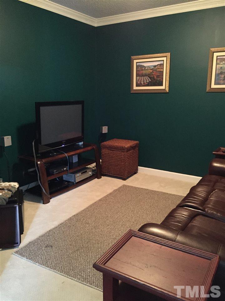 3548 Dewing Drive Raleigh, NC 27616 - Photo 5 of 12 a bedroom with a bed and a flat screen tv