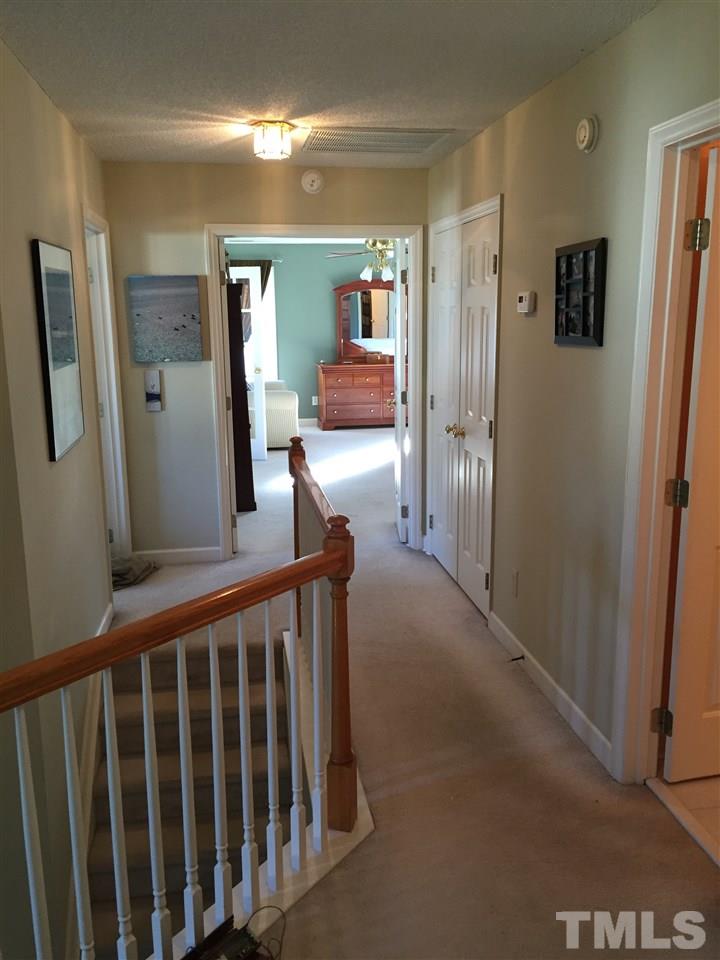 3548 Dewing Drive Raleigh, NC 27616 - Photo 8 of 12 a view of a hallway with a livingroom and furniture