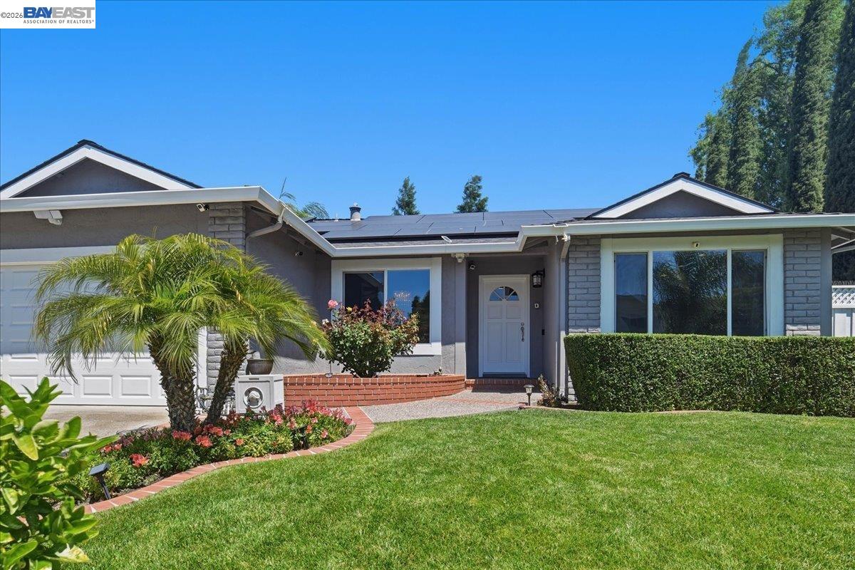2861 Millbridge Place San Ramon, CA 94583 - Photo 4 of 58 a front view of a house with a yard and porch