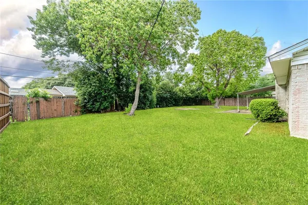 a view of a backyard with a garden