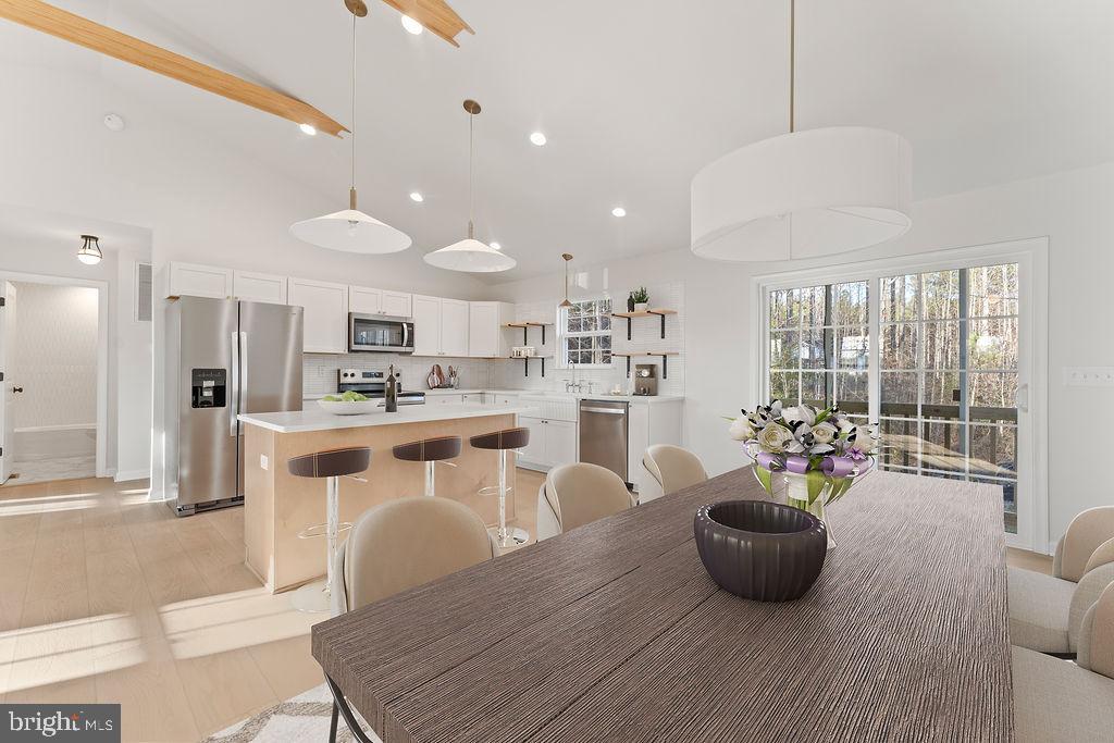 2770 Fredericks Hall Road Mineral, VA 23117 - Photo 13 of 57 a living room with stainless steel appliances furniture and a kitchen view
