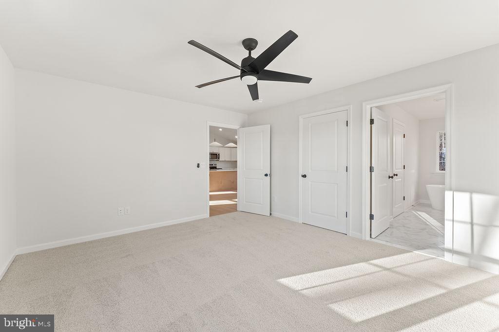 2770 Fredericks Hall Road Mineral, VA 23117 - Photo 22 of 57 a view of a livingroom with a ceiling fan and window