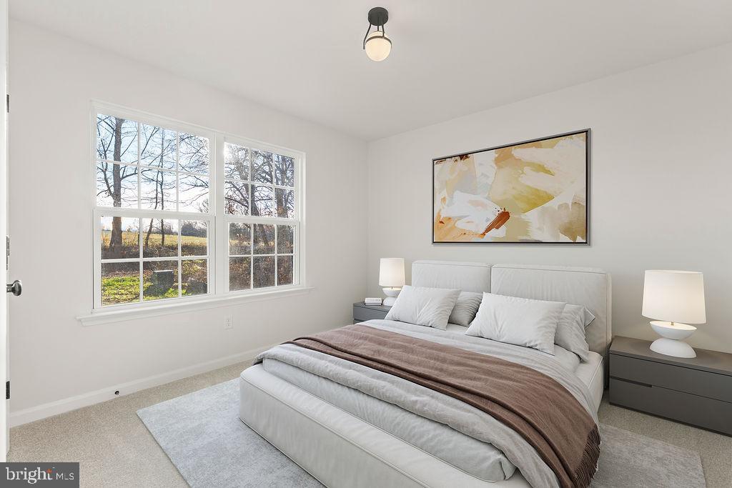 2770 Fredericks Hall Road Mineral, VA 23117 - Photo 26 of 57 a bedroom with a bed and a painting on the wall