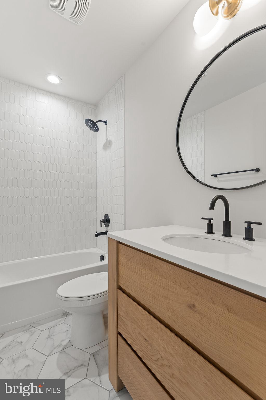 2770 Fredericks Hall Road Mineral, VA 23117 - Photo 30 of 57 a bathroom with a sink a toilet and a mirror