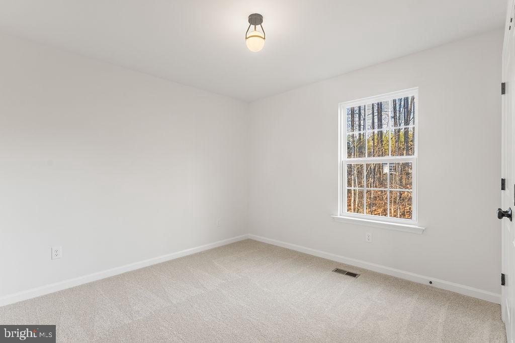 2770 Fredericks Hall Road Mineral, VA 23117 - Photo 31 of 57 an empty room with a window