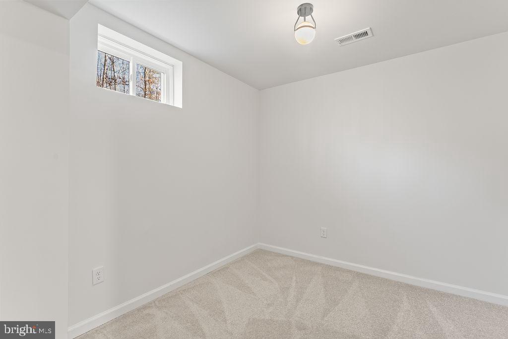 2770 Fredericks Hall Road Mineral, VA 23117 - Photo 44 of 57 an empty room with a workbench