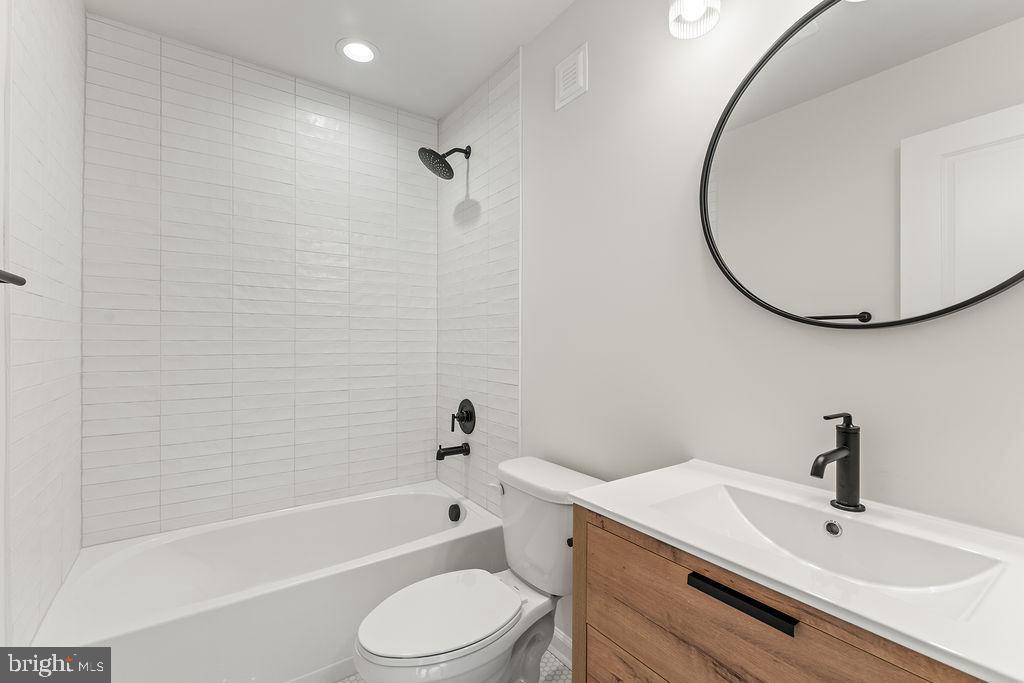 2770 Fredericks Hall Road Mineral, VA 23117 - Photo 45 of 57 a bathroom with a sink a toilet and a bathtub