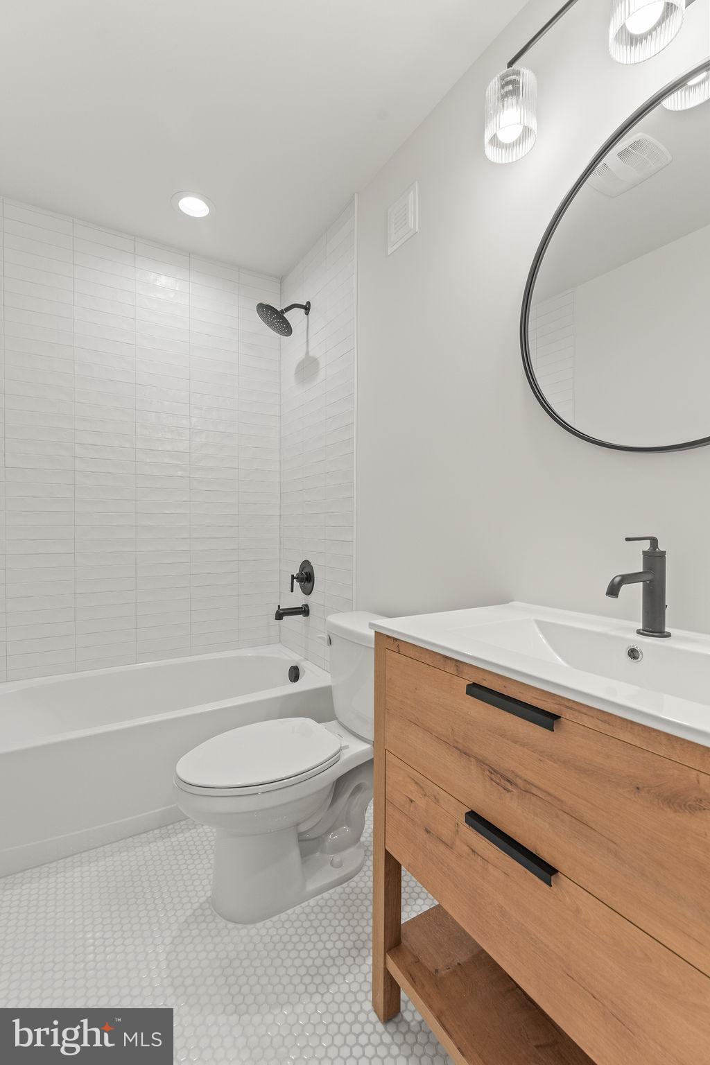 2770 Fredericks Hall Road Mineral, VA 23117 - Photo 46 of 57 a bathroom with a sink a toilet and a mirror