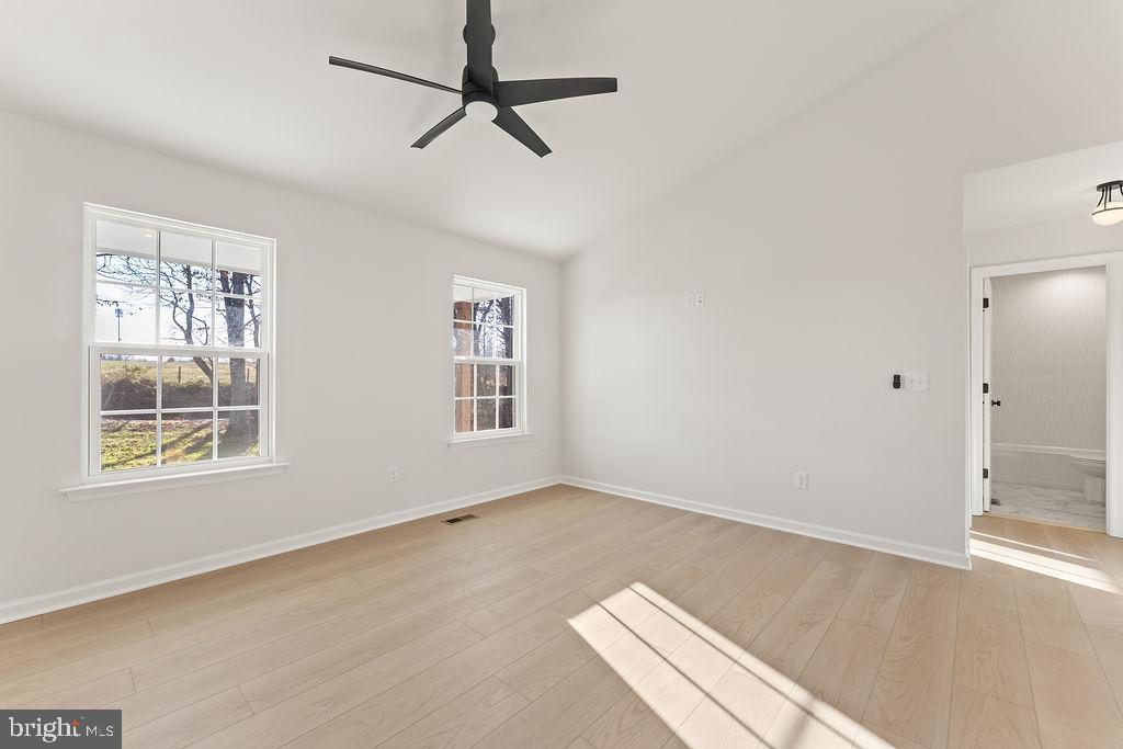 2770 Fredericks Hall Road Mineral, VA 23117 - Photo 6 of 57 wooden floor in an empty room with a window