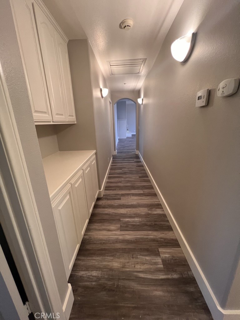 8715 Dufferin Avenue Riverside, CA 92504 - Photo 12 of 27 a view of a hallway with wooden floor and staircase