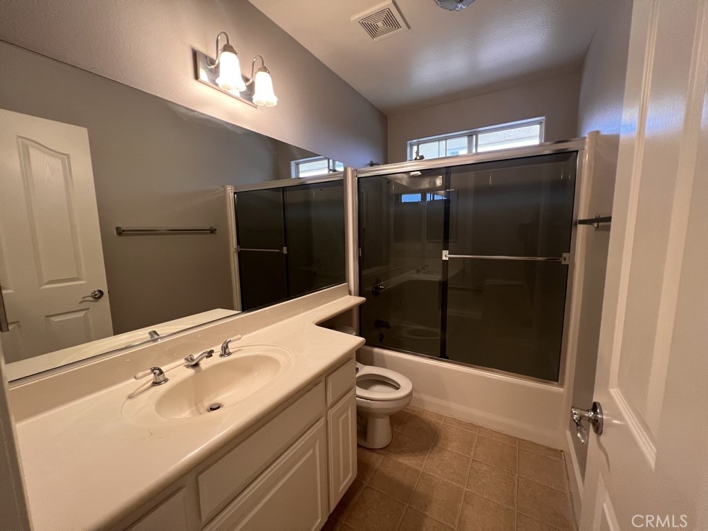 8715 Dufferin Avenue Riverside, CA 92504 - Photo 18 of 27 a bathroom with a sink toilet and shower