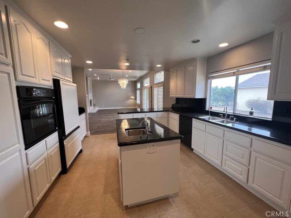 8715 Dufferin Avenue Riverside, CA 92504 - Photo 2 of 27 a large white kitchen with a large window