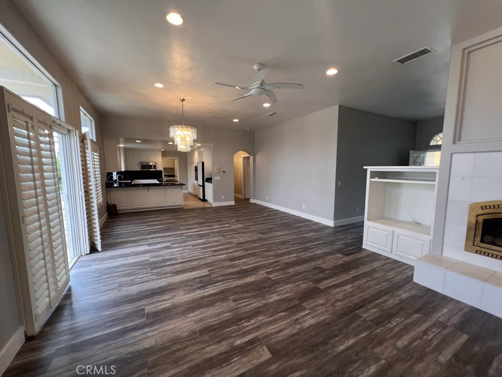 8715 Dufferin Avenue Riverside, CA 92504 - Photo 5 of 27 a view of a big room with wooden floor and a kitchen