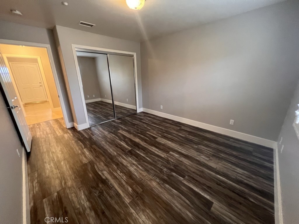 8715 Dufferin Avenue Riverside, CA 92504 - Photo 10 of 27 a view of a room with wooden floor