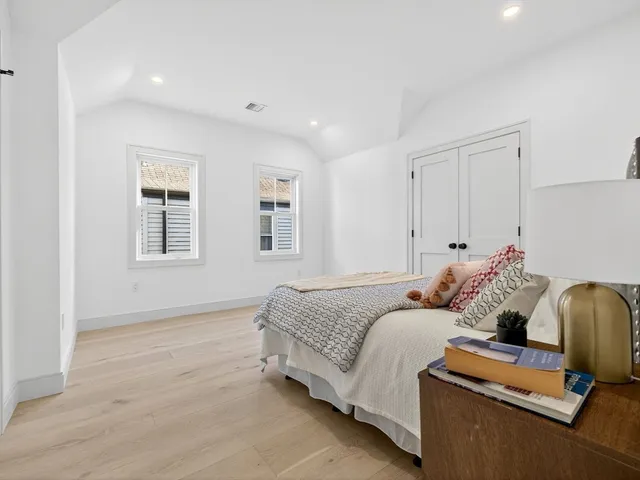 a bedroom with bed and window