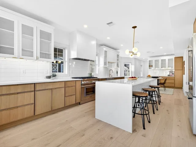 a kitchen with counter top space cabinets and appliances