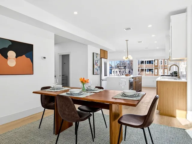 a dining room with a table and chairs