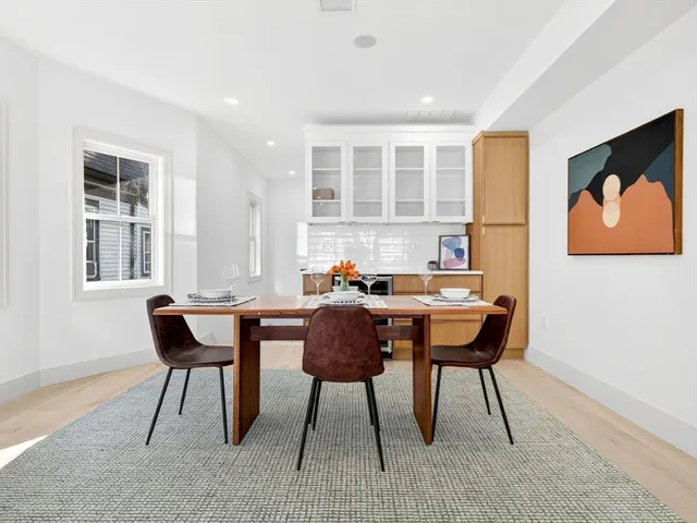 a view of a dining room with furniture and window