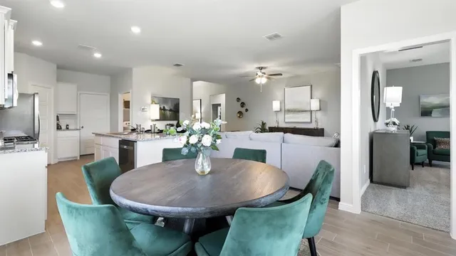 a view of a dining room with furniture and wooden floor