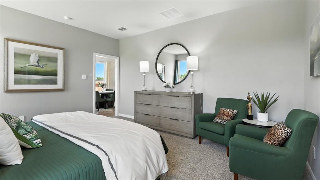 313 Potato Street Keene, TX 76059 - Photo 17 of 40 a bedroom with a bed and a couch