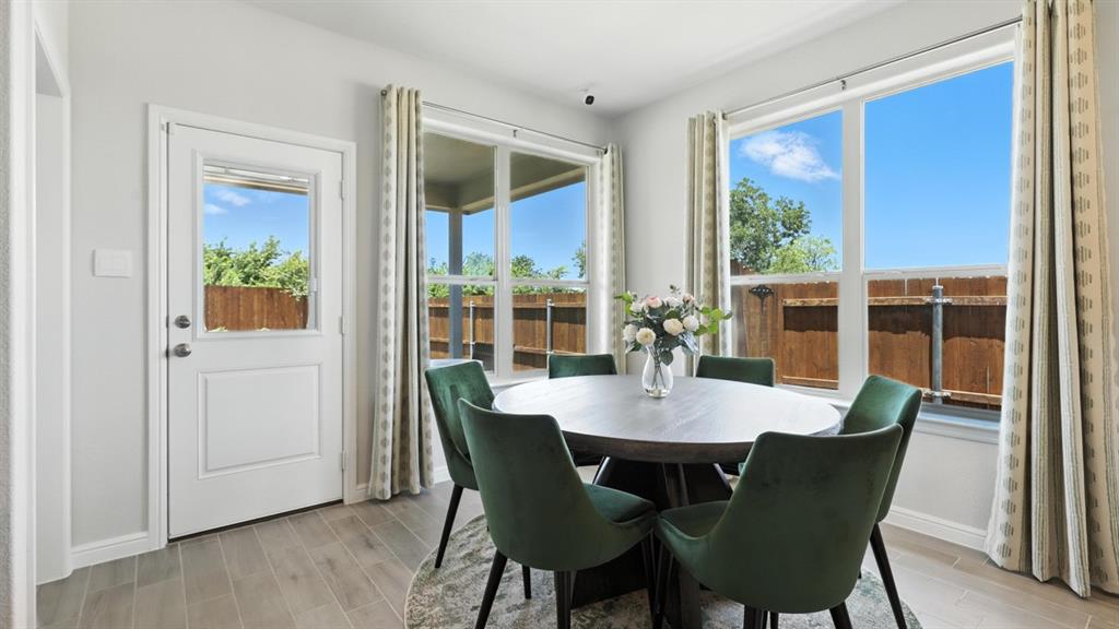 313 Potato Street Keene, TX 76059 - Photo 7 of 40 a view of a dining room with furniture window and outside view
