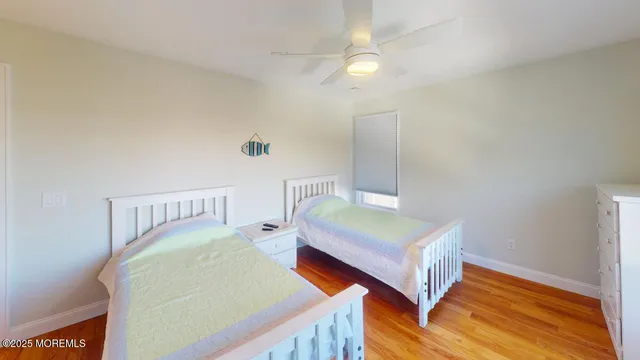 a bedroom with a bed and a night stand