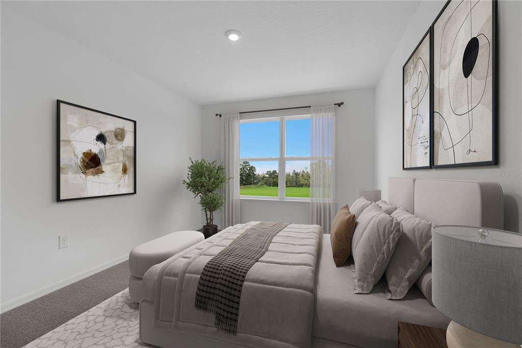 6032 Cliffbow Loop Leesburg, FL 34748 - Photo 11 of 31 a bedroom with a bed and a painting on the wall