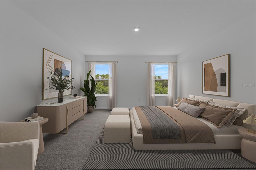 6032 Cliffbow Loop Leesburg, FL 34748 - Photo 16 of 31 a bedroom with a large bed couch and windows