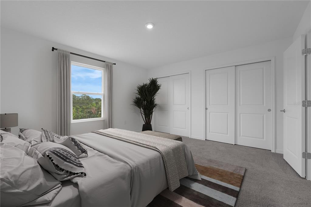 6032 Cliffbow Loop Leesburg, FL 34748 - Photo 5 of 31 a bedroom with a bed and a window