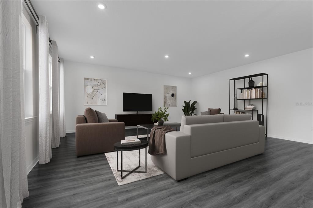 6032 Cliffbow Loop Leesburg, FL 34748 - Photo 6 of 31 a living room with furniture a flat screen tv and a refrigerator