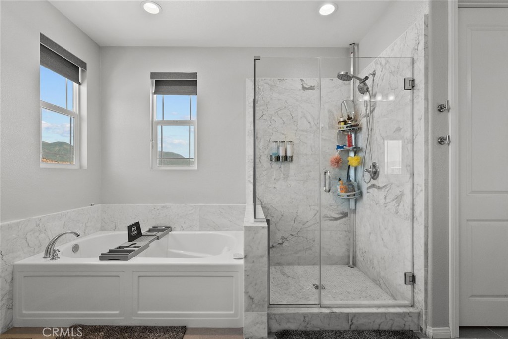 232 River Street Fillmore, CA 93015 - Photo 44 of 61 a bathroom with a sink a mirror a glass door a shower and vanity