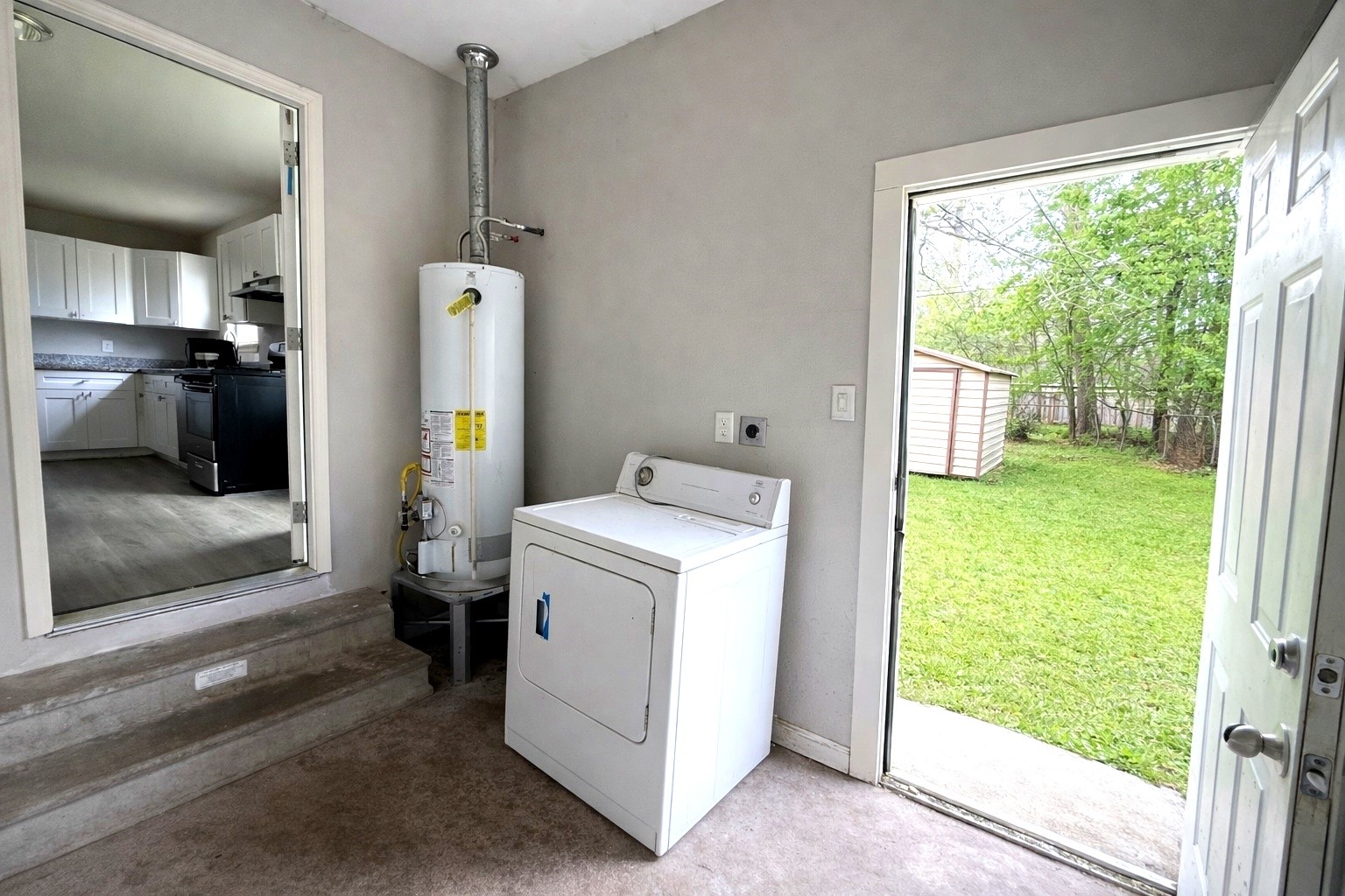10341 Caxton Street Houston, TX 77016 - Photo 10 of 17 Laundry and utility area with backyard access.