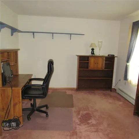 a view of workspace with furniture and windows