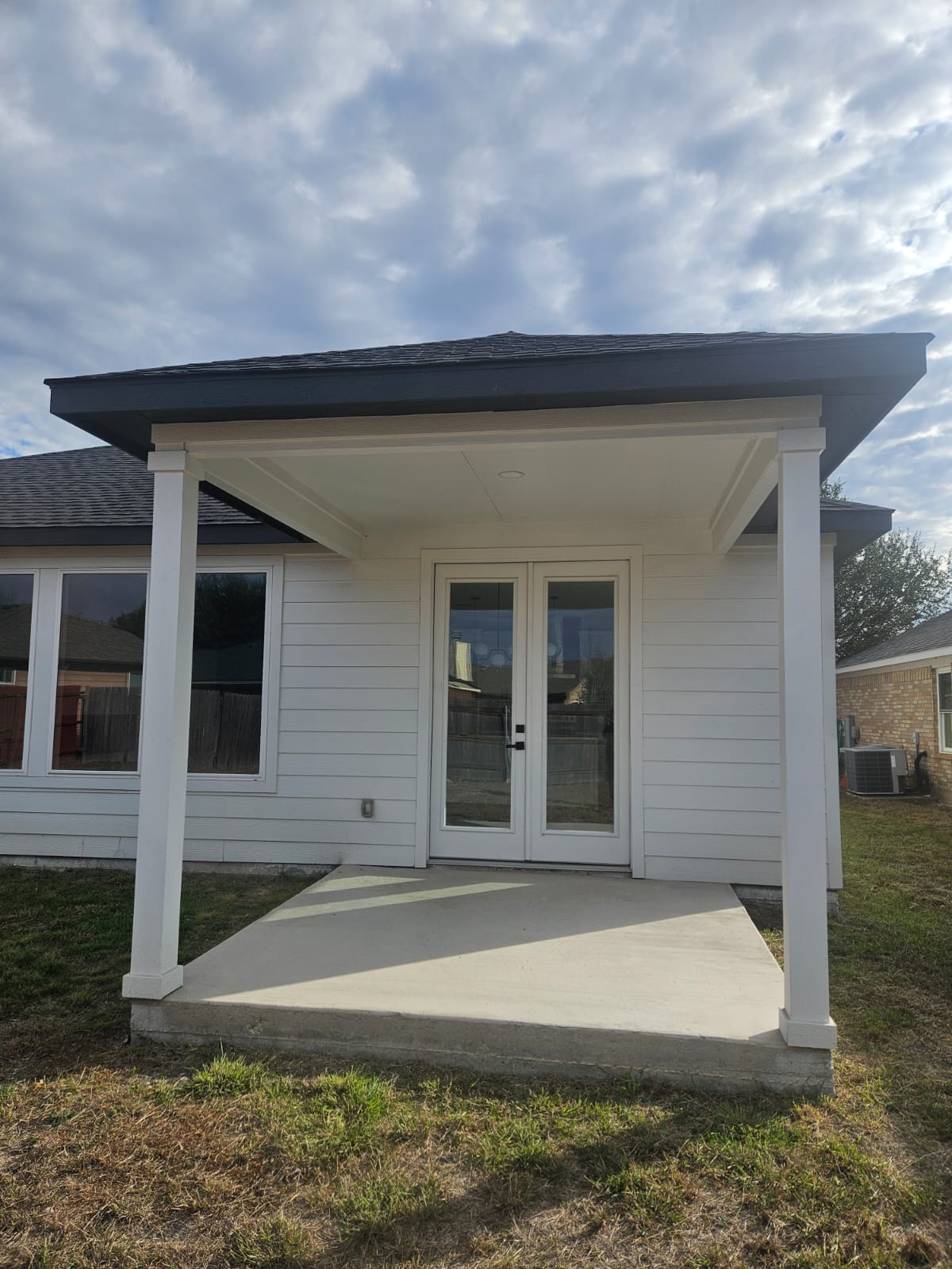 2413 Blue Sky Lane Lockhart, TX 78644 - Photo 34 of 39 Property entrance featuring a patio, french doors, and roof with shingles