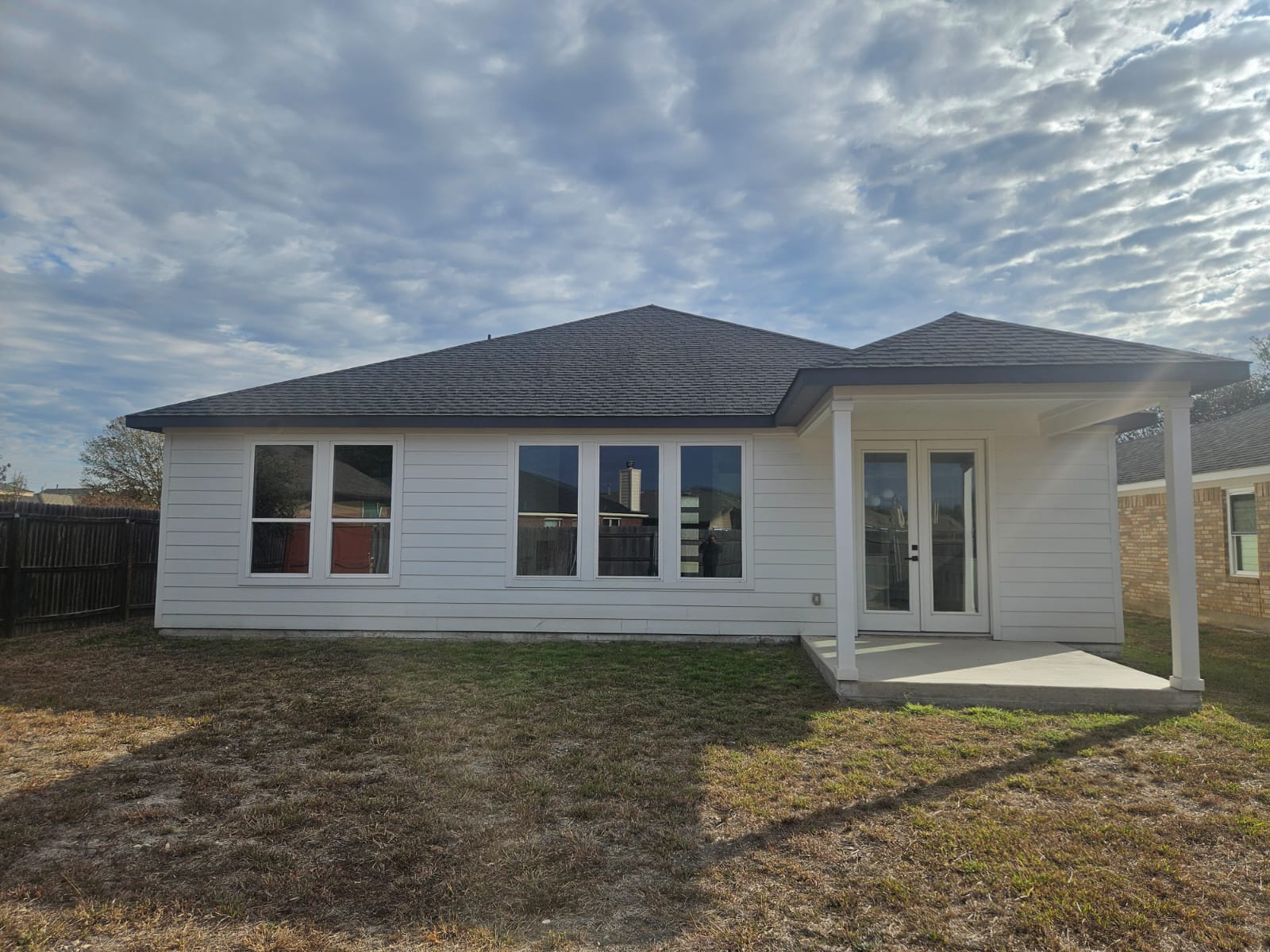 2413 Blue Sky Lane Lockhart, TX 78644 - Photo 36 of 39 Rear view of property with a patio area, french doors, and a shingled roof