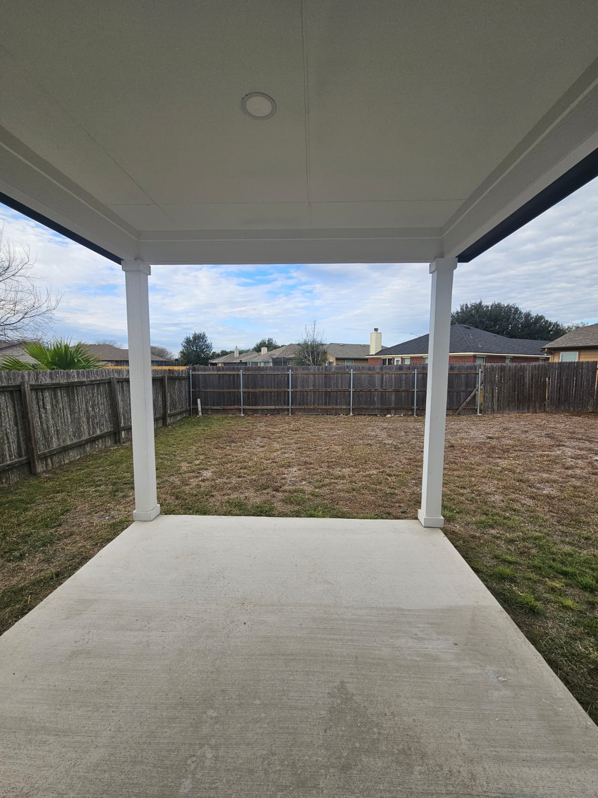 2413 Blue Sky Lane Lockhart, TX 78644 - Photo 37 of 39 Fenced backyard with a patio