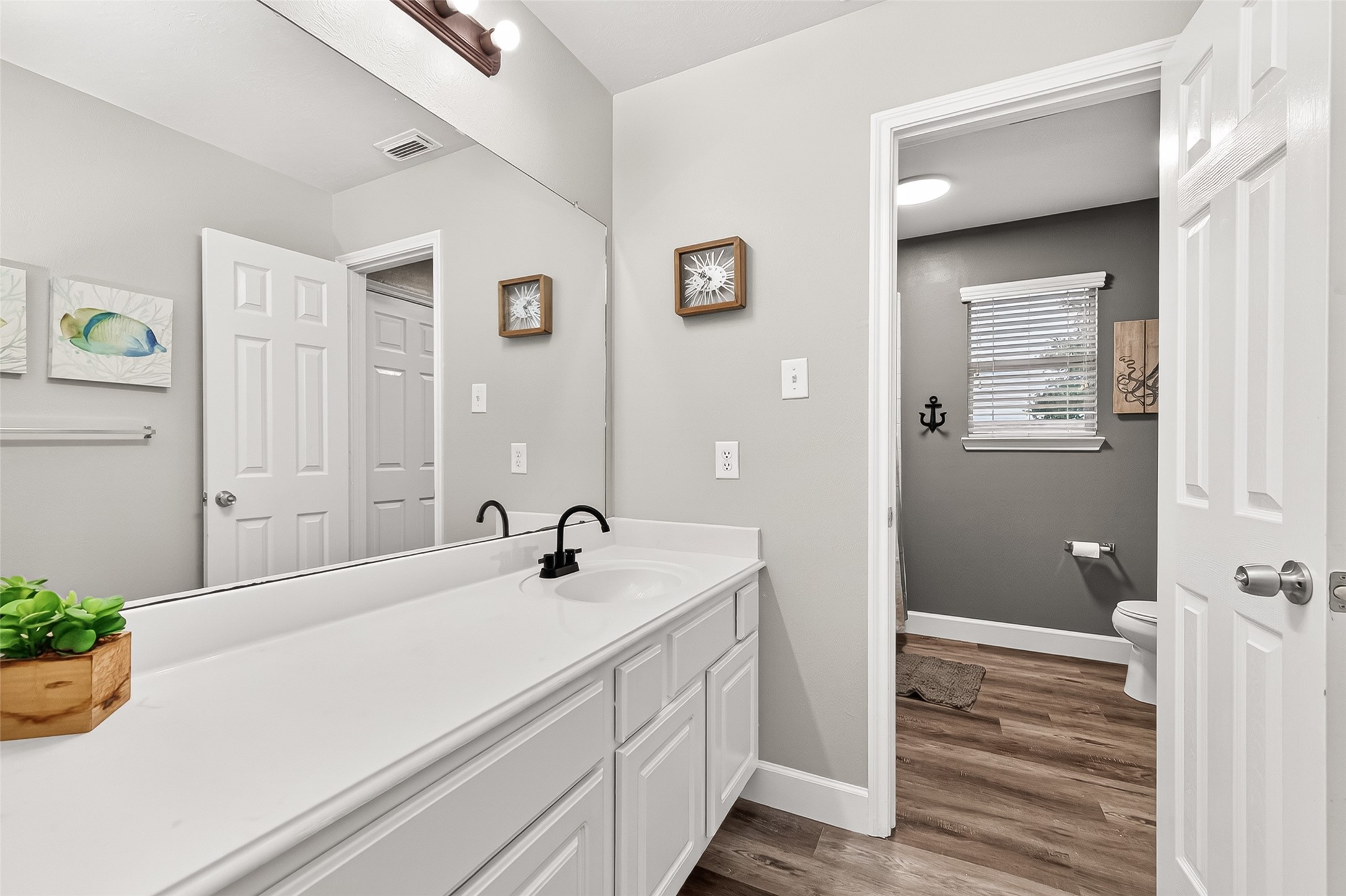 7415 Riven Oaks Court Cypress, TX 77433 - Photo 33 of 42 Upstairs full bathroom featuring an extended vanity, updated faucet fixtures, and a functional layout designed for comfort and convenience.