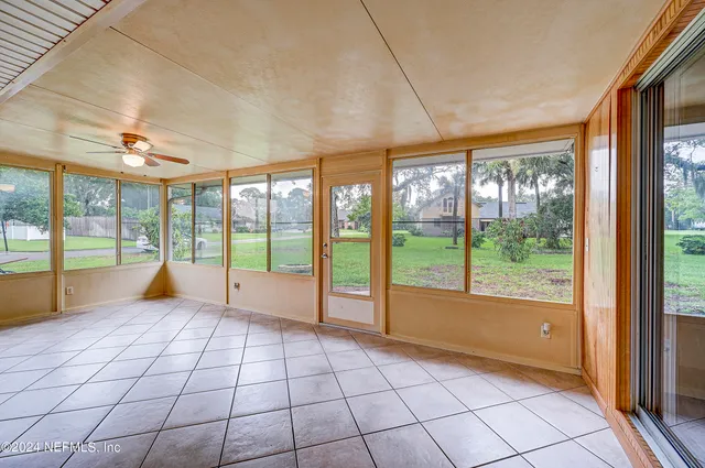 a view of an empty room with a large window