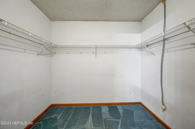 a view of a room with racks on the wall