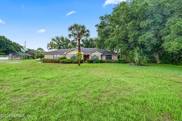 a house view with swimming pool