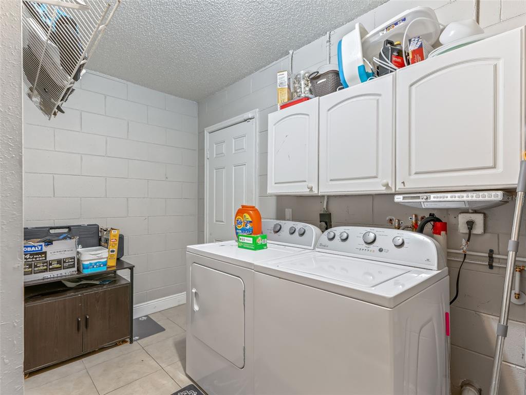 911 Jacaranda Drive Lady Lake, FL 32159 - Photo 19 of 24 a utility room with dryer and washer