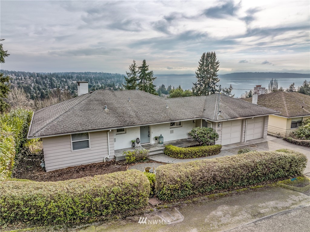 17031 12th Place Southwest Normandy Park, WA 98166 - Photo 1 of 29 a aerial view of a house with a garden