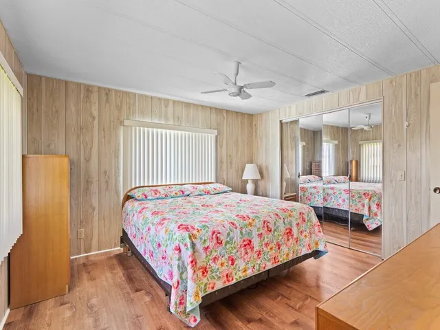 a bathroom with a sink toilet vanity and shower