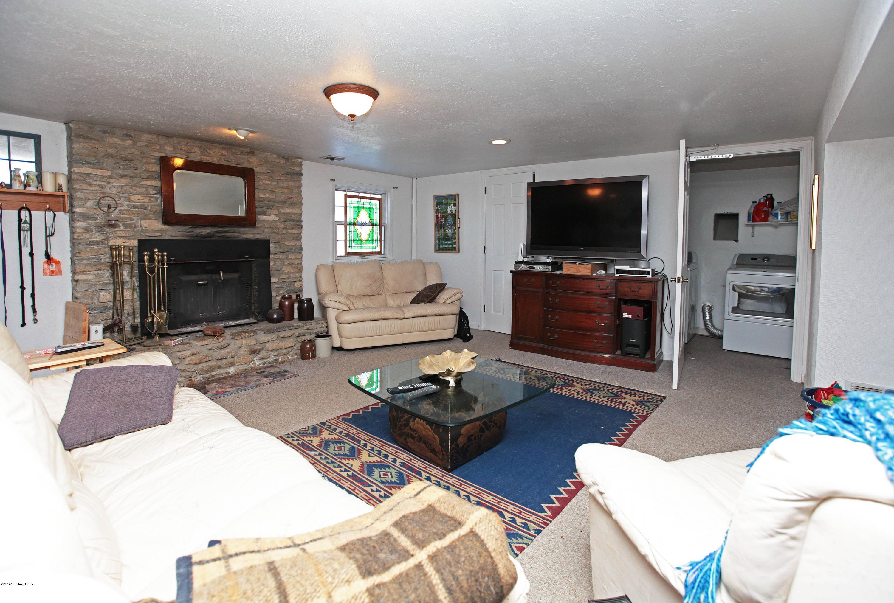 4 Lincoln Run Road Louisville, KY 40245 - Photo 31 of 36 Another view of this second family room area. Note stone fireplace and open door to laundry room.