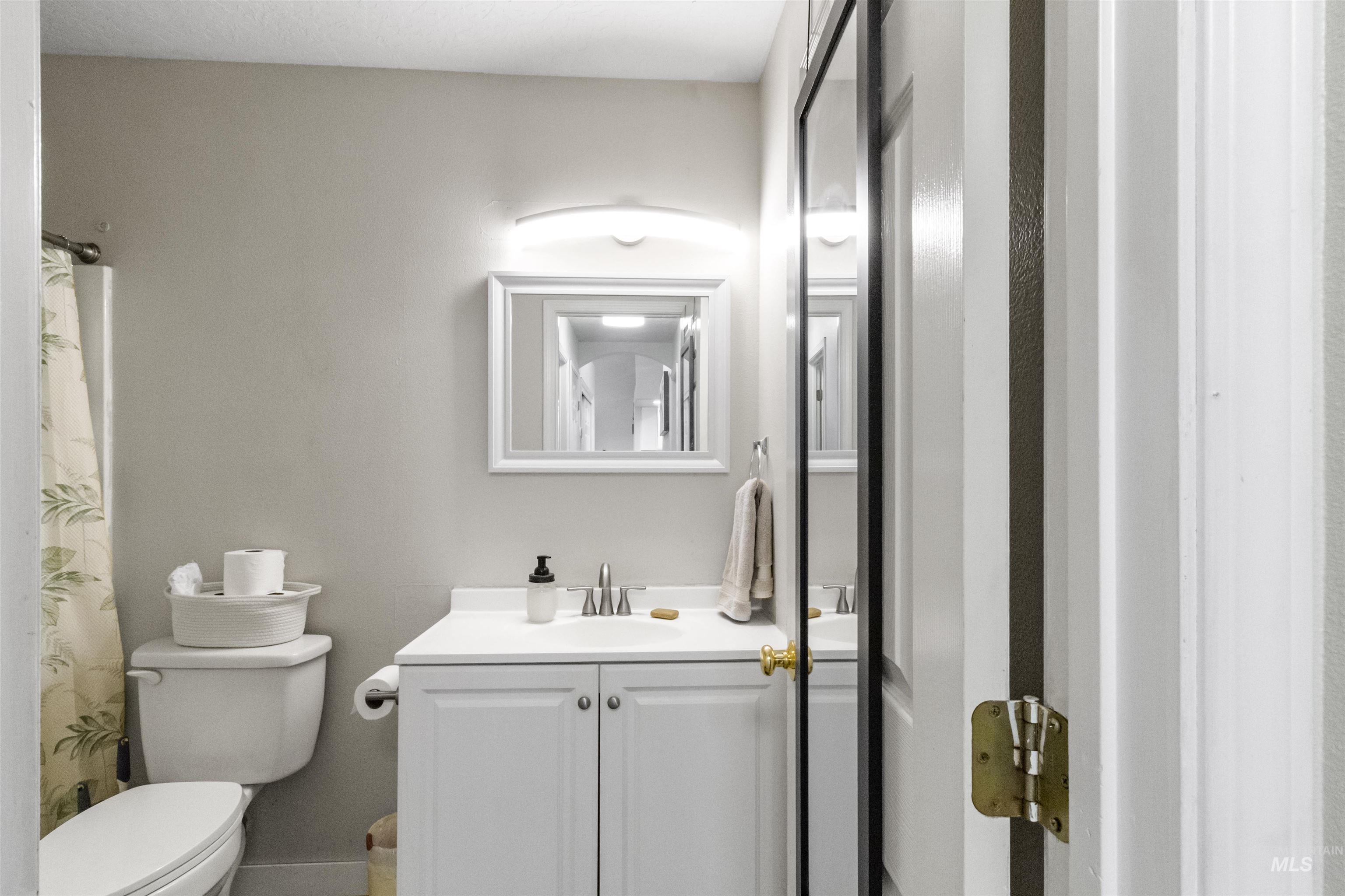 1823 Cambridge Street Caldwell, ID 83607 - Photo 9 of 10 Bathroom with vanity and a shower with curtain