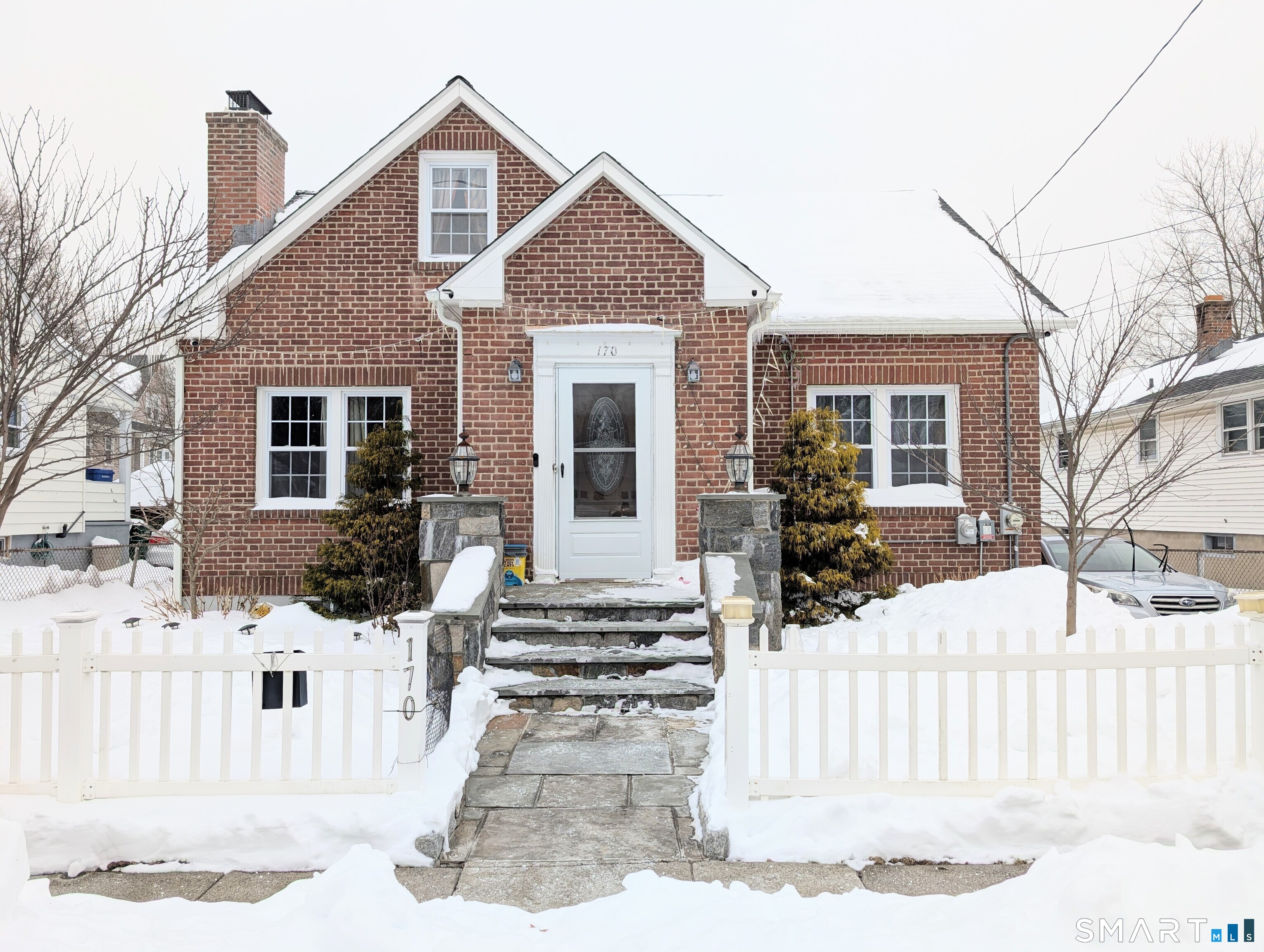 a front view of a house with a fence