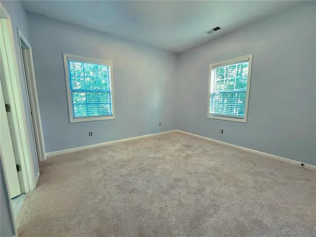 an empty room with windows