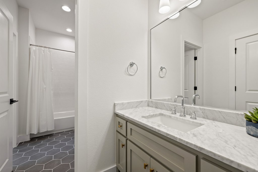 7516 Davenport Divide Road Austin, TX 78738 - Photo 32 of 40 The shared full bath offers two separate vanities, one for each bedroom.