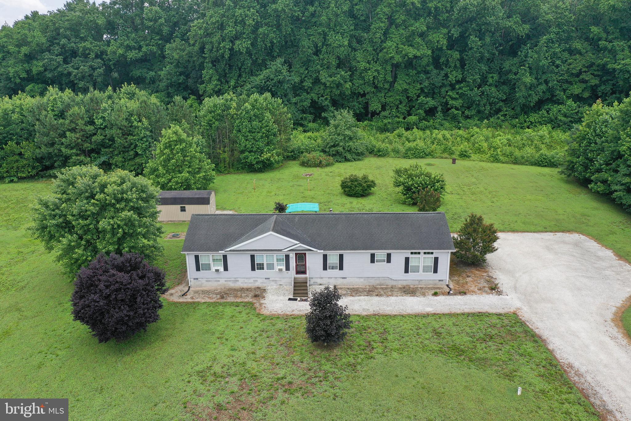 5846 Puckum Road Rhodesdale, MD 21659 - Photo 1 of 32 an aerial view of a house with garden space and a house