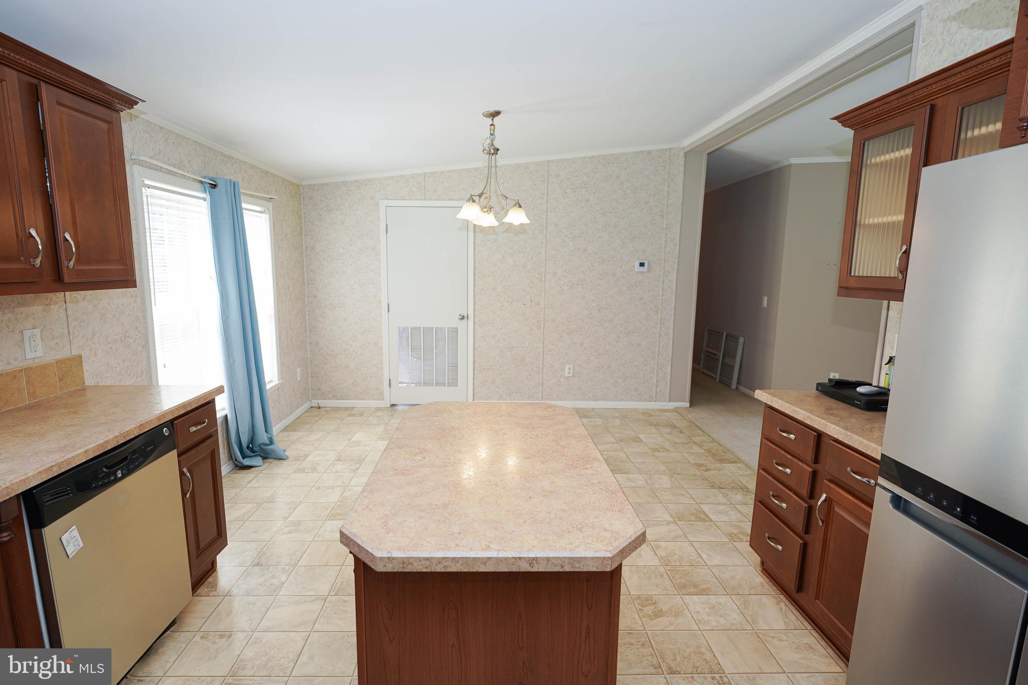 5846 Puckum Road Rhodesdale, MD 21659 - Photo 12 of 32 a kitchen with stainless steel appliances granite countertop a sink stove and refrigerator